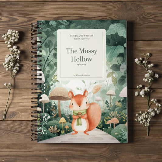 A spiral-bound children's book titled "The Mossy Hollow" by Whimsical Writers, featuring a forest illustration with a squirrel on the cover, styled on a wooden surface with dried white flowers.