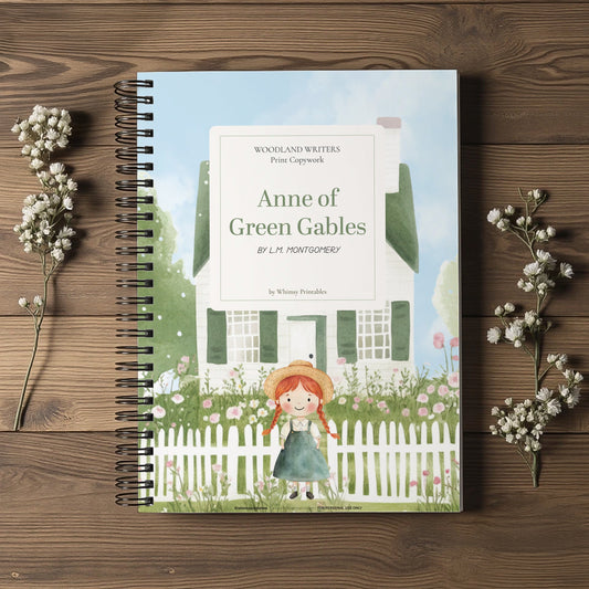 A spiral-bound book titled "Anne of Green Gables" by L.M.